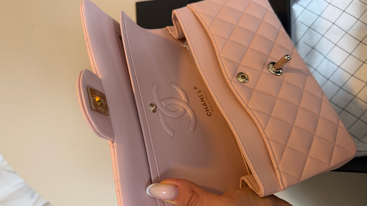 Small lambskin classic flap Chanel in baby pink with chip