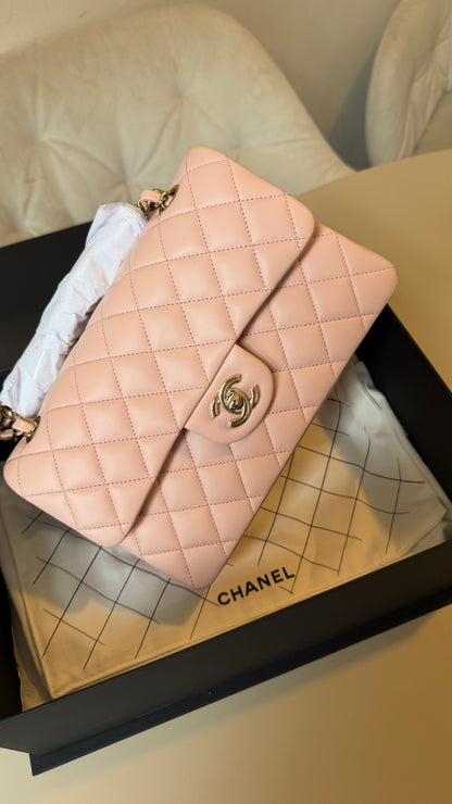 Small lambskin classic flap Chanel in baby pink with chip